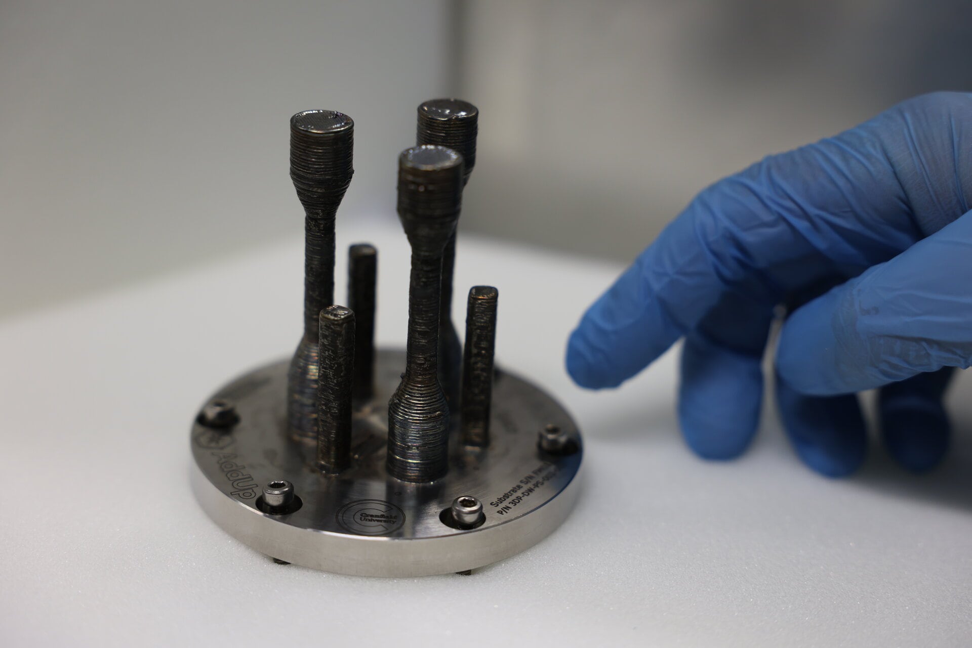 The first metal piece printed in 3D in the space returned to Earth