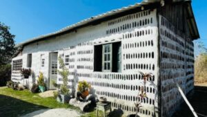 They collected 8,000 glass bottles over two years and ended up building a seven-bedroom house